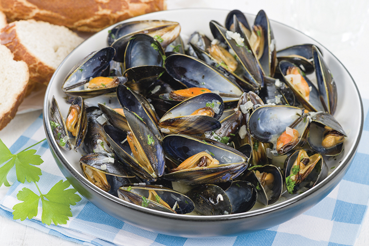 Moules Marinieres - Mussels cooked with white wine sauce.