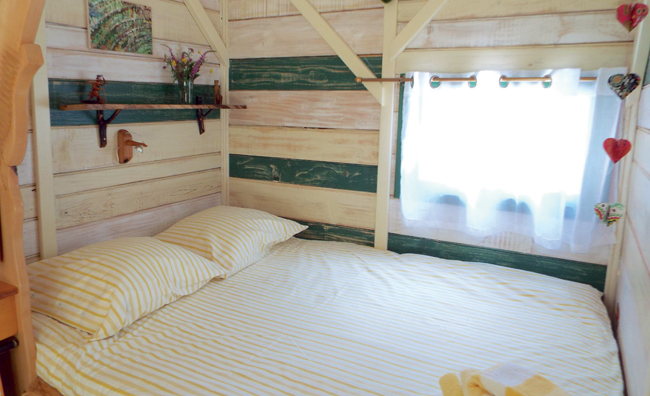 bedroom of cabin in the woods