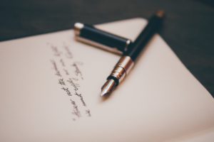 Fountain pen writing on a notepad