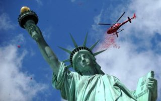 France showers Lady Liberty with flowers: stirring tribute in New York on the 70th anniversary of D-Day