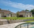 A five bedroom stone house with a pool and outbuildings