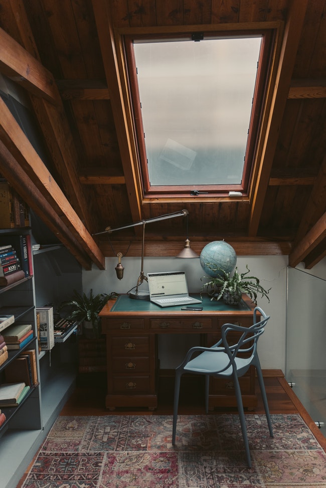 Silver Macbook on Brown Wooden Desk Near Window