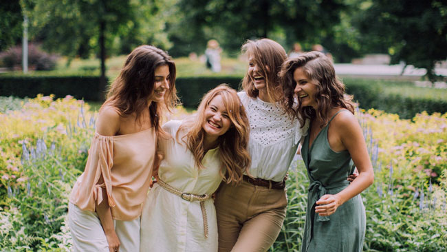 Four women laughing