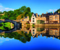 The Old stone bridge and historical medieval houses reflecting in La Rance river in Dinan town port, Brittany, France