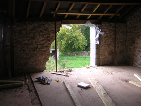 barn conversion limousin wall with a hole in it